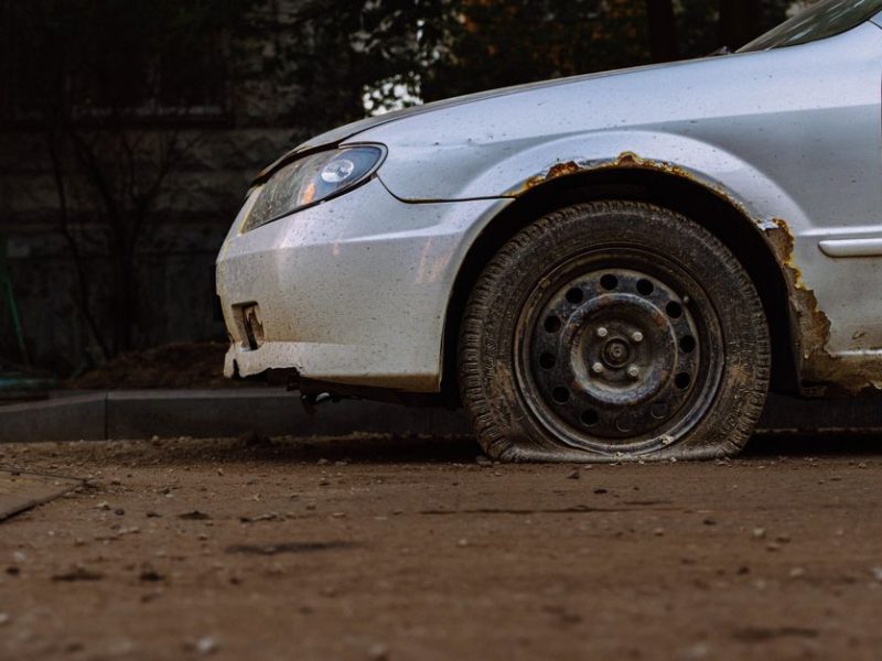 2009 Nissan Altima with flat tires curbside pickup in Summerlin